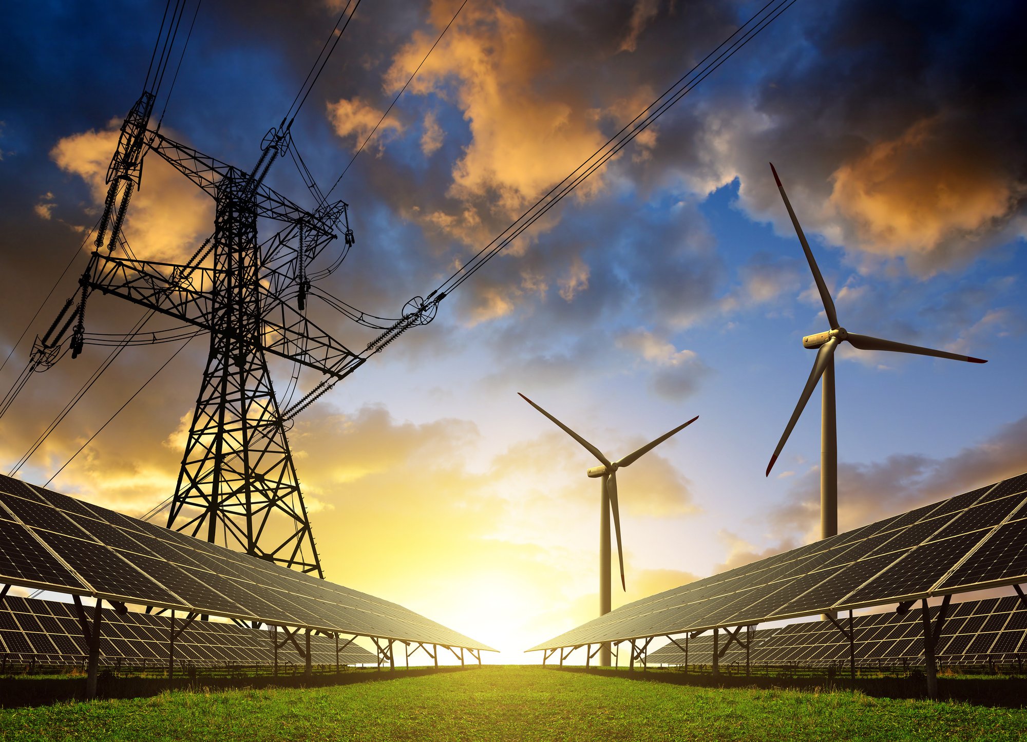 transformer with solar panels and wind turbines with sun in background