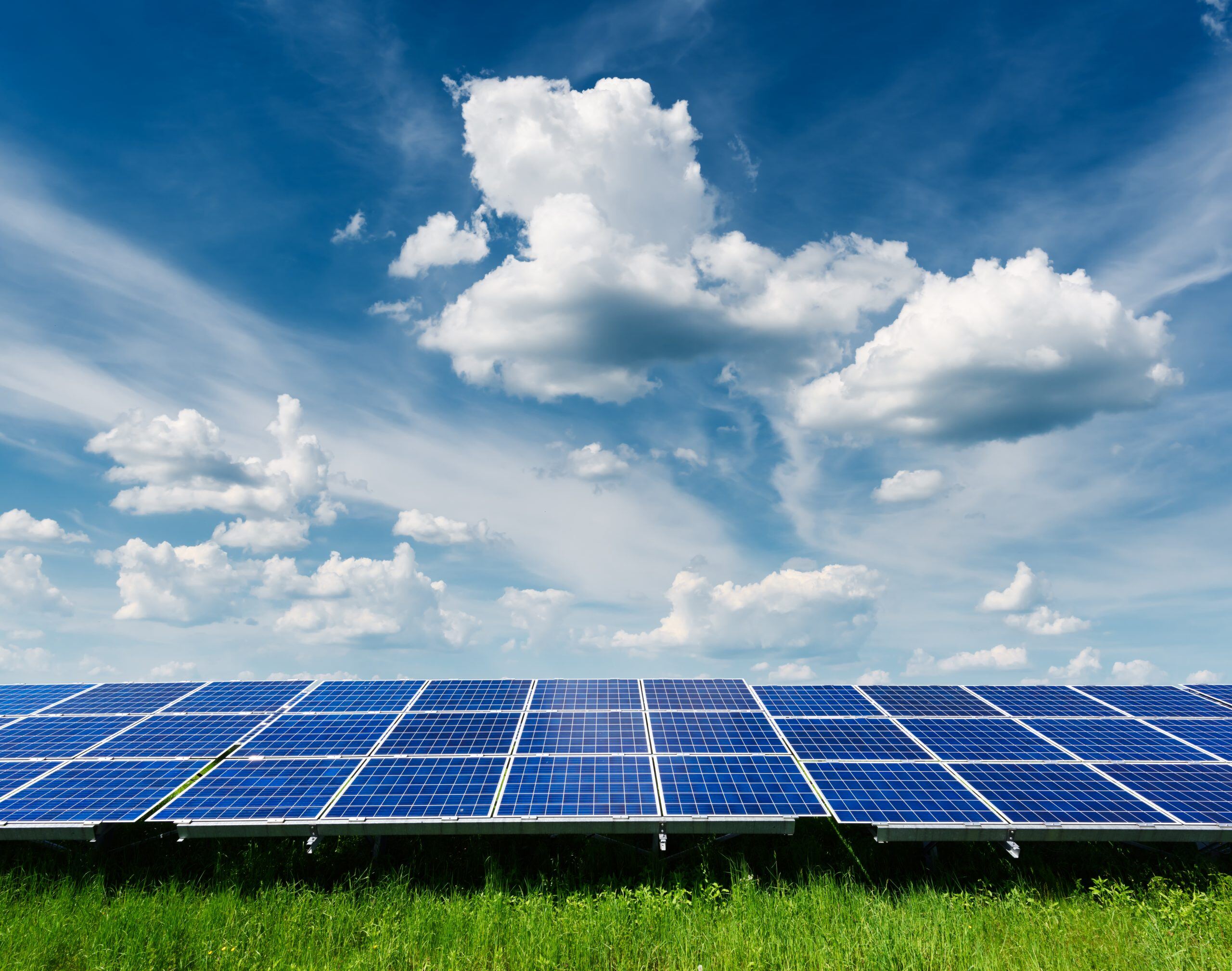 solar-panel-on-blue-sky-background-W2AZNUE-scaled