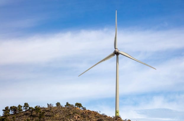 wind-turbine-renewable-energy-on-a-rocky-hill-2021-08-30-20-01-02-utc-1024x675