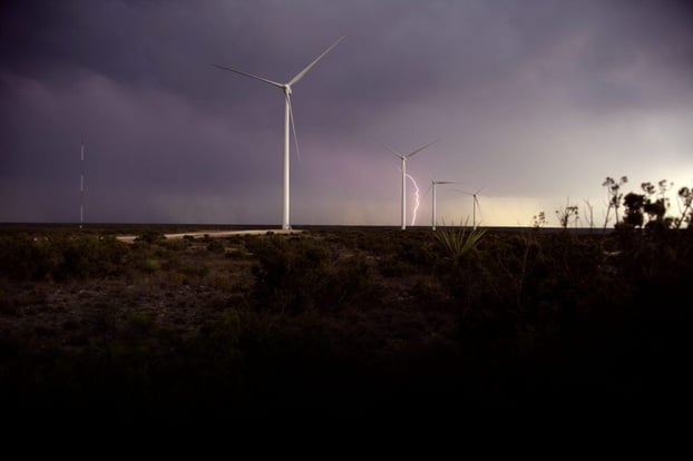 windmills-on-field-against-storm-clouds-2022-05-26-04-24-04-utc-1024x683