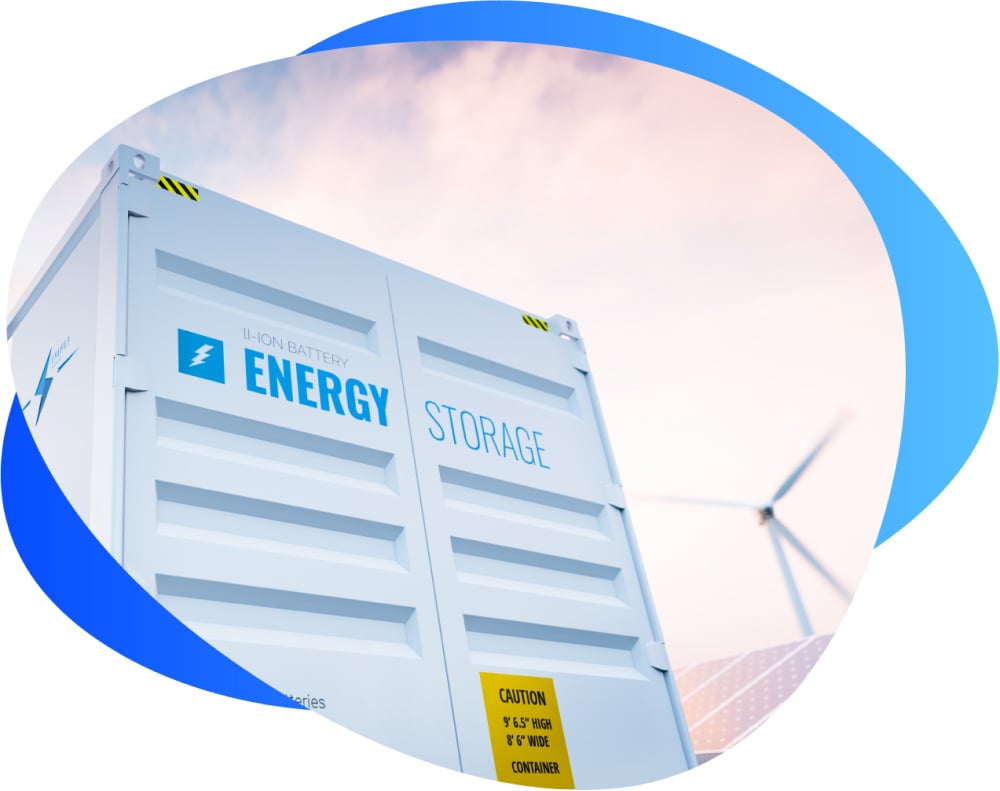 white battery storage container with wind turbine in background outside