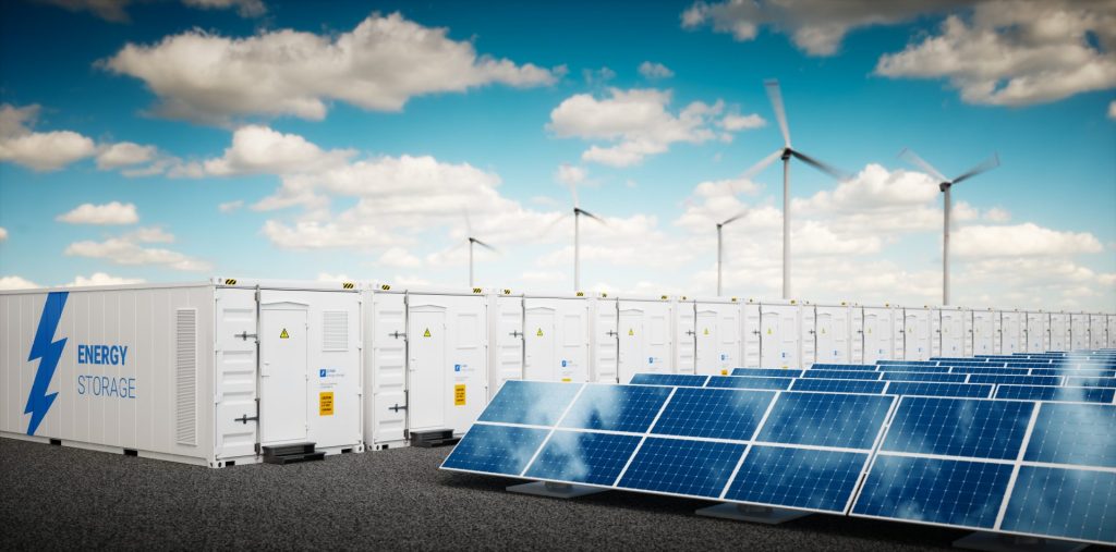 energy storage, solar array and wind turbines with blue sky and white cloud background